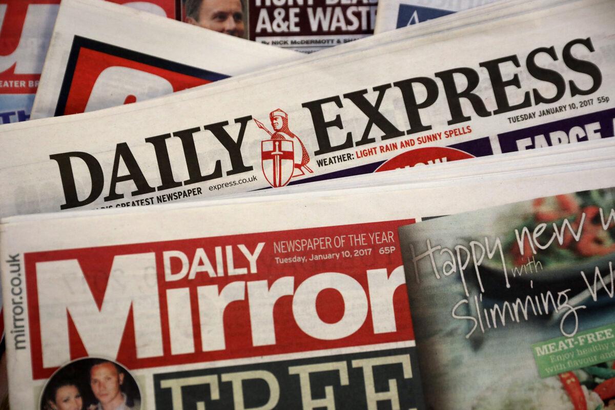 A photo illustration of British national newspapers The Daily Mirror and the Daily Express, in London, England, on Jan. 10, 2017. (Dan Kitwood/Getty Images)