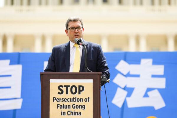 Benedict Rogers, a UK human rights activist, speaks at a rally commemorating the 20th anniversary of the persecution of Falun Gong in China, on the West lawn of Capitol Hill in Washington on July 18, 2019. (Samira Bouaou/The Epoch Times)