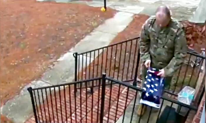 Touching Video Captures a Soldier Folding a Fallen American Flag Outside Stranger’s House