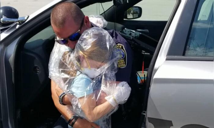 Georgia Officer’s Daughter Wraps Up in Protective Gear and Gives Her Dad an Emotional Hug
