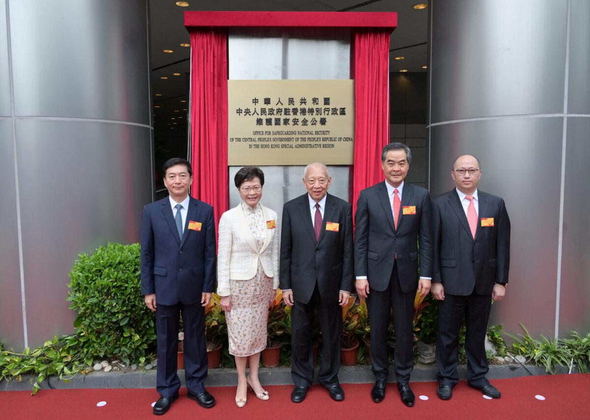 Hong Kong Chief Executive Carrie Lam attends the plaque unveiling ceremony of the Office for Safeguarding National Security (OSNS) of the Central People's Government in the HKSAR, with the director of the Liaison Office of the Central People's Government in the HKSAR and the national security adviser to the Committee for Safeguarding National Security of the HKSAR, Luo Huining, the vice chairman of the National Committee of the Chinese People's Political Consultative Conference, Tung Chee-hwa and Leung Chun-ying, and the head of the OSNS, Zheng Yanxiong, on July 8, 2020. (Hong Kong Information Services Department/Handout via Reuters)