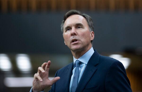 Then-Finance Minister Bill Morneau rises in the House of Commons after delivering a speech presenting the government’s fiscal snapshot on July 8, 2020 in Ottawa. (The Canadian Press/Adrian Wyld)