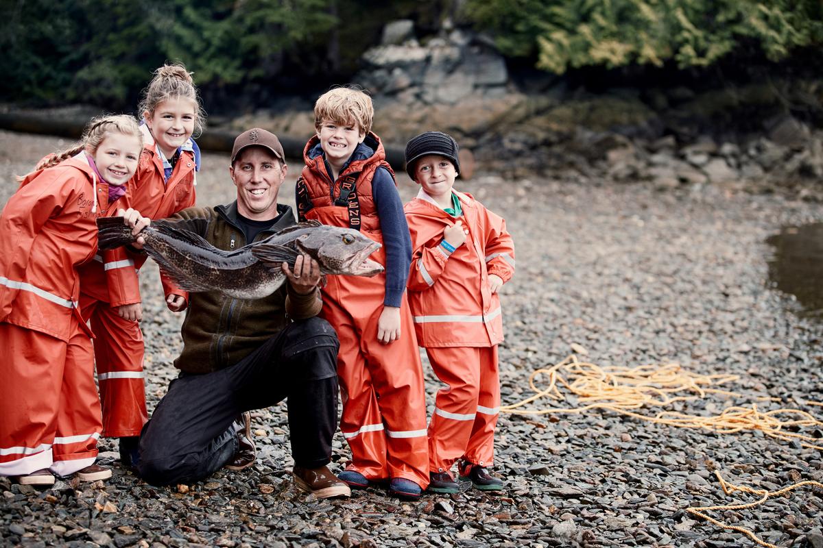 Kids with catch of the day with a fisherman. (Courtesy of Princess)