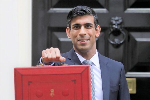 Britain's Chancellor of the Exchequer Rishi Sunak stands outside No 11 Downing Street and holds up the traditional red box that contains the budget speech for the media,, in London, Britain, on March 11, 2020. (Kirsty Wigglesworth/AP Photo)