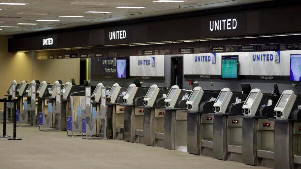  Empty United Airlines ticket machines are shown at the Tampa International Airport in Tampa, Fla., on April 24, 2020 (Chris O'Meara/AP)