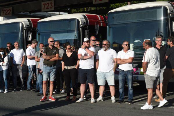 Bus drivers of the public transport network of Bayonne, southwestern France, waits for the visit of French Junior Transports Minister on July 7, 2020, a day after a bus driver was declared brain-dead after being attacked for refusing to let aboard passengers without face masks in line with rules imposed to combat the CCP virus. (Iroz Gaizka/AFP via Getty Images)