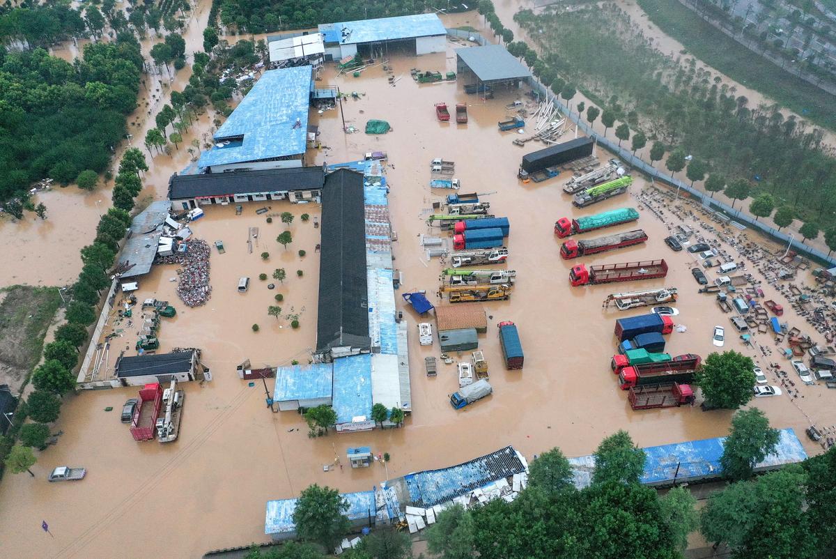 Inundated buildings and vehicles after heavy rain caused flooding in Shexian county, Huangshan city, in eastern China's Anhui Province on July 7, 2020. (STR/AFP via Getty Images)