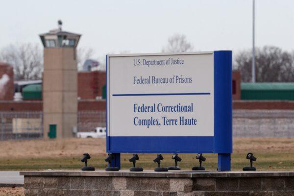 The guard tower flanks the sign at the entrance to the U.S. Penitentiary in Terre Haute, Ind., on Dec. 10, 2019. (Michael Conroy/File/AP Photo)