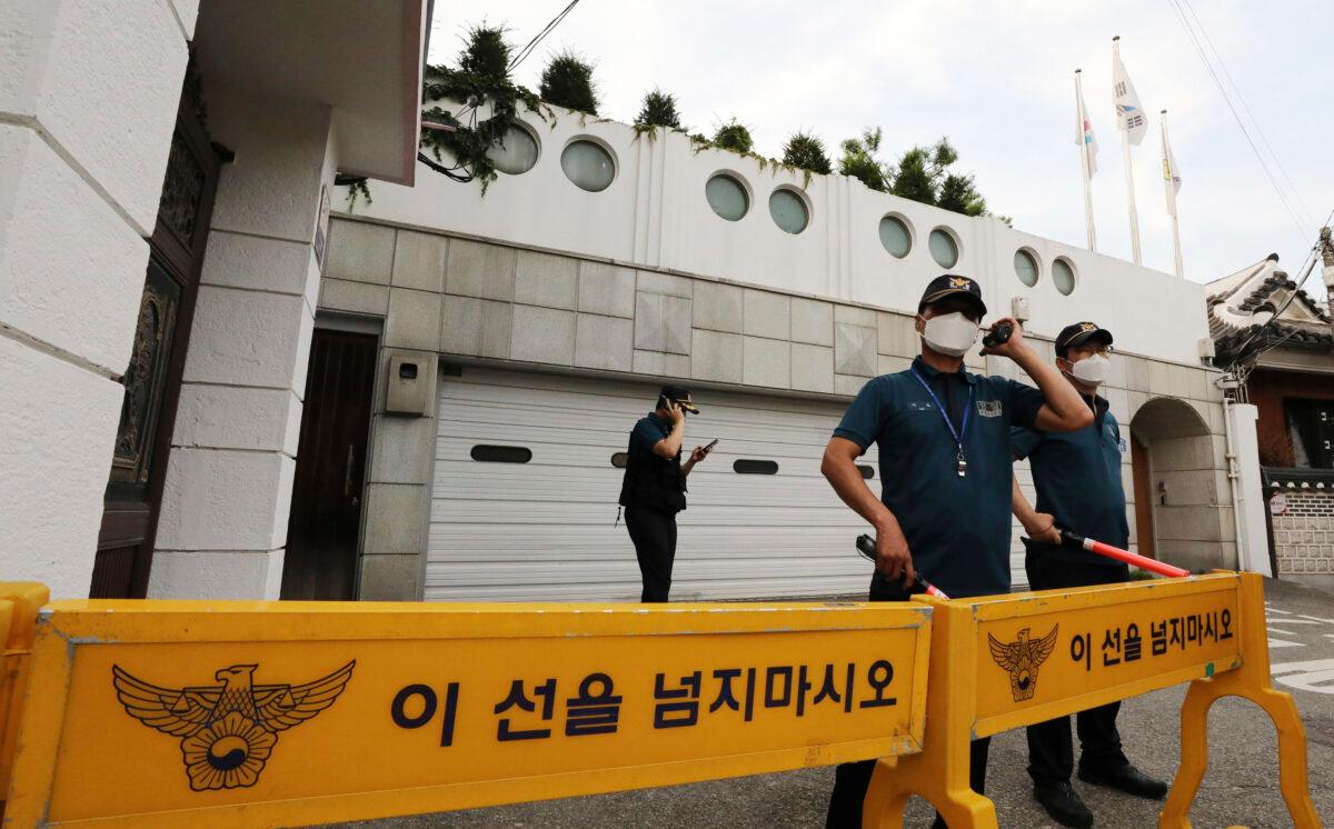 Police officers stand guard in front of the house of Seoul Mayor Park Won-soon in Seoul, South Korea, on July 9, 2020. (Park Ju-sung/Newsis/AP)