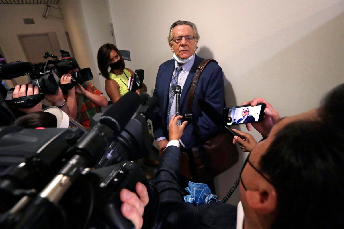 Attorney John Henry Browne speaks with reporters after his client, Dawit Kelete, made a court appearance in Seattle on July 6, 2020. (Elaine Thompson/AP Photo)