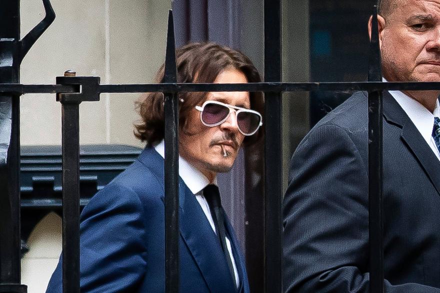 Actor Johnny Depp leaves the High Court in London on July 7, 2020. (Aaron Chown/PA via AP)