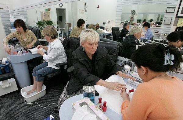 A file photo of women receiving manicures at JT Nails in San Francisco, Calif., on March 3, 2006. (Justin Sullivan/Getty Images)