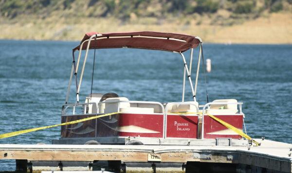 A boat rented by "Glee" actress Naya Rivera sits at a dock while members of Ventura County Sheriff's Office search for the actress at Lake Piru in Los Padres National Forest, northwest of Los Angeles, on July 9, 2020. Rivera's 4-year-old son was found alone on the boat. (Chris Pizzello/AP Photo)