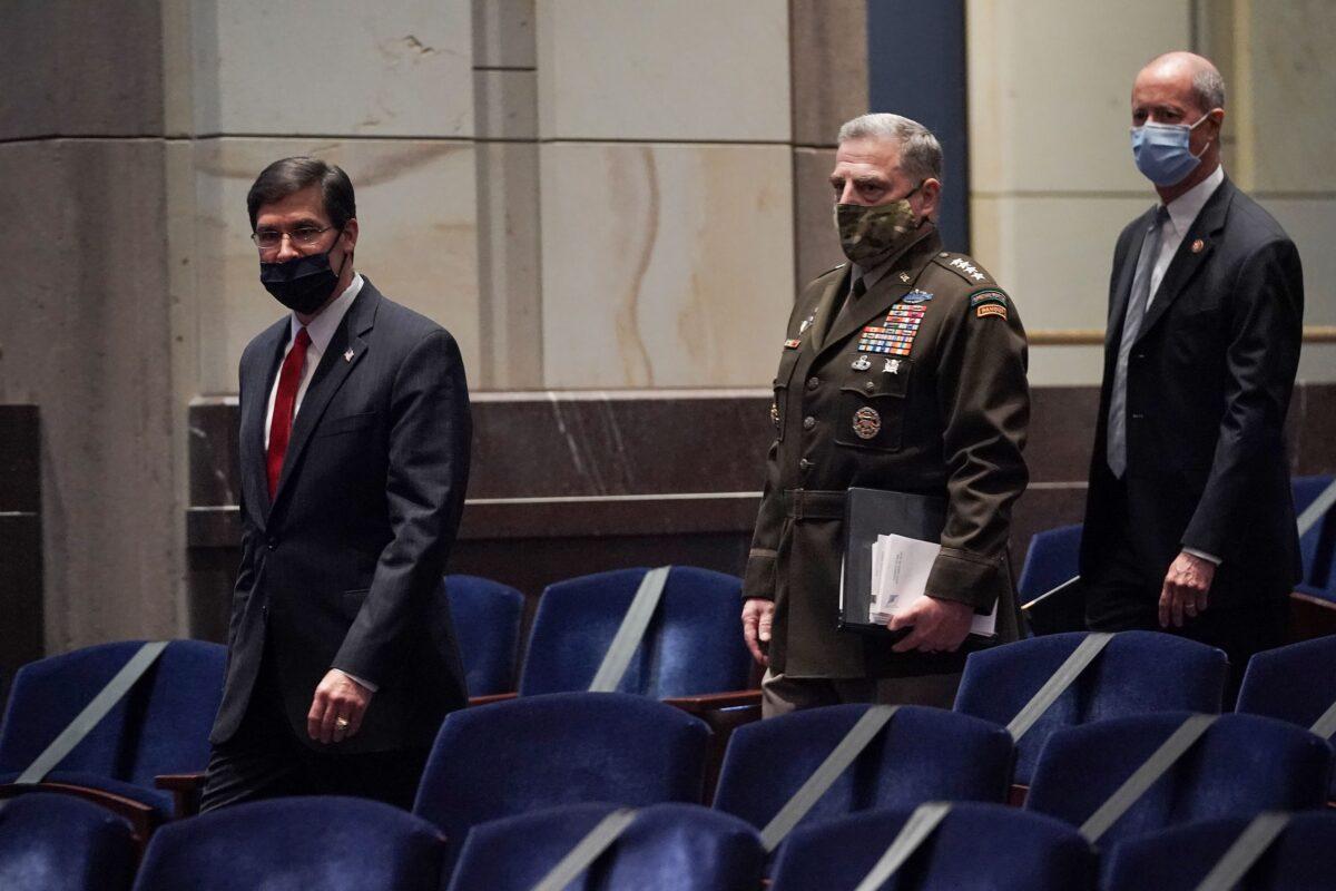 Secretary of Defense Mark Esper, Joint Chiefs Chairman Gen. Mark Milley, and Rep. Mac Thornberry (R-Texas) arrive for a House Armed Services Committee hearing in Washington on July 9, 2020. (Greg Nash/Pool/AFP via Getty Images)