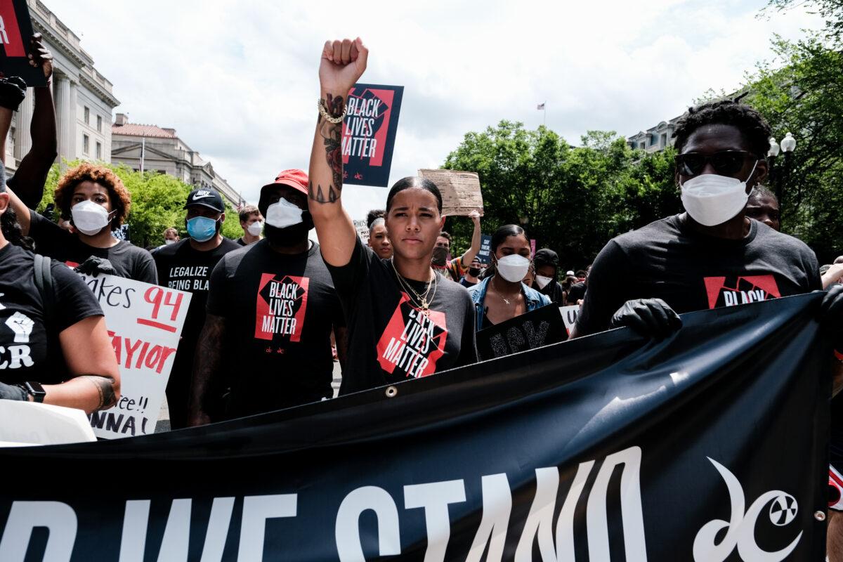 Natasha Cloud marches to the MLK Memorial to support Black Lives Matter and to mark the liberation of slavery, in Washington on June 19, 2020. (Michael A. McCoy/Getty Images)