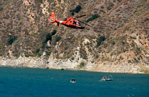A helicopter helps in the search for former "Glee" star Naya Rivera, at Lake Piru in Los Padres National Forest, northwest of Los Angeles on July 9, 2020. (Ringo H.W. Chiu/AP Photo)