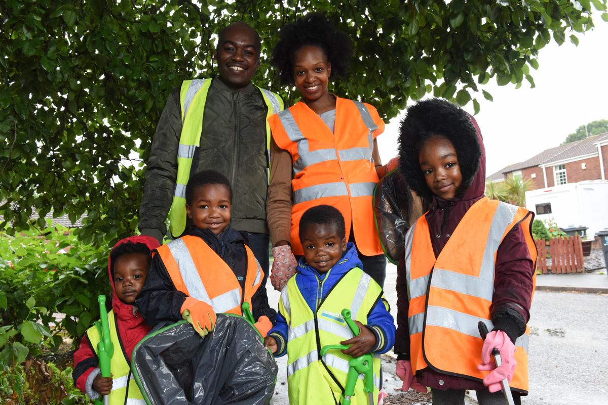 The Roberts family is teaching their kids to keep the community clean. (Caters News)