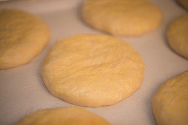 Flatten the balls of dough and arrange them on a baking sheet. (Photo by Susan Butler)