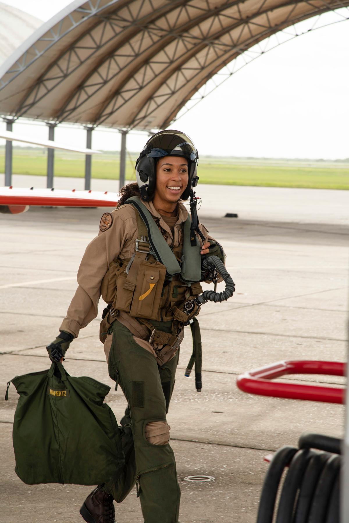 Student Naval aviator Lt. j.g. Madeline Swegle, assigned to the Redhawks of Training Squadron (VT) 21 at Naval Air Station Kingsville, Texas, exits a T-45C Goshawk training aircraft. (<a href="https://www.navy.mil/view_image.asp?id=317472">Anne Owens</a>/U.S. Navy)