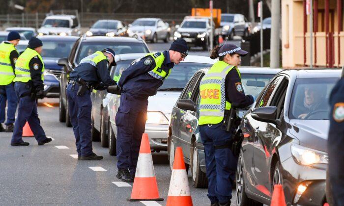 Woman Arrested for COVID Checkpoint Breach in Melbourne