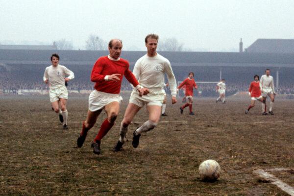 Leeds United's Jack Charlton, (R), challenges his brother Manchester United's Bobby Charlton during a soccer match in Leeds, England, on Jan. 11, 1969. (PA via AP)