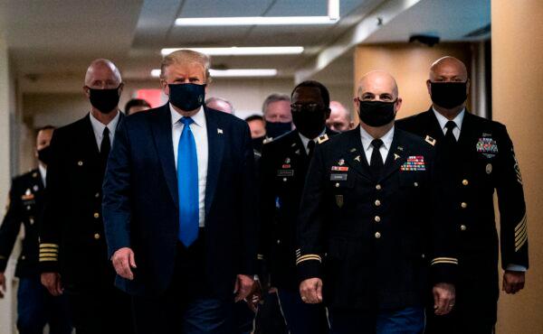 President Donald Trump wears a mask as he visits Walter Reed National Military Medical Center in Bethesda, Md., on July 11, 2020. (Alex Edelman/AFP via Getty Images)
