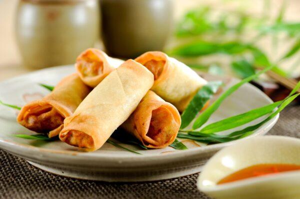 Spring rolls have smooth, thinner, and flakier outsides. (naito29/Shutterstock)