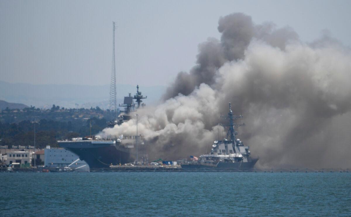 Smoke rises from the USS Bonhomme Richard at Naval Base San Diego after an explosion and fire on board the ship, on July 12, 2020. (Denis Poroy/AP Photo)