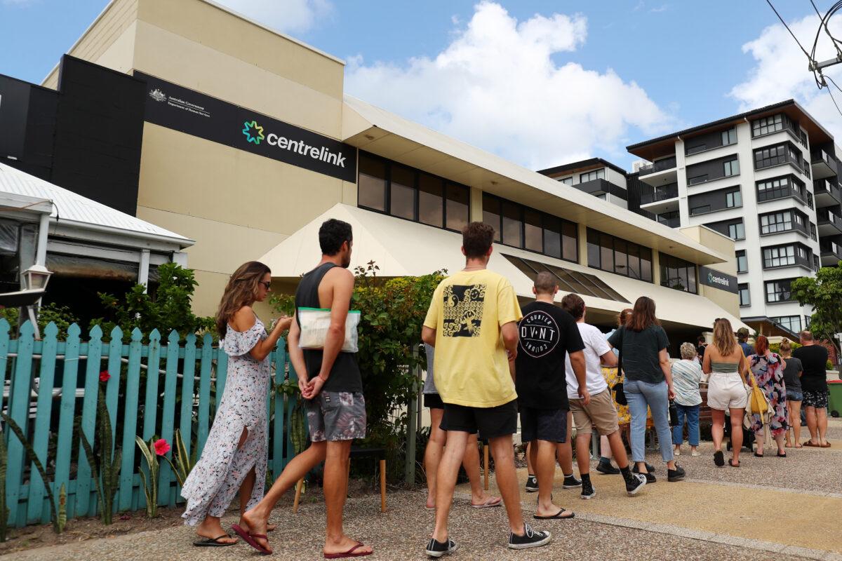People queue outside Centrelink in Palm Beach in Gold Coast, Australia on March 23, 2020. (Chris Hyde/Getty Images)