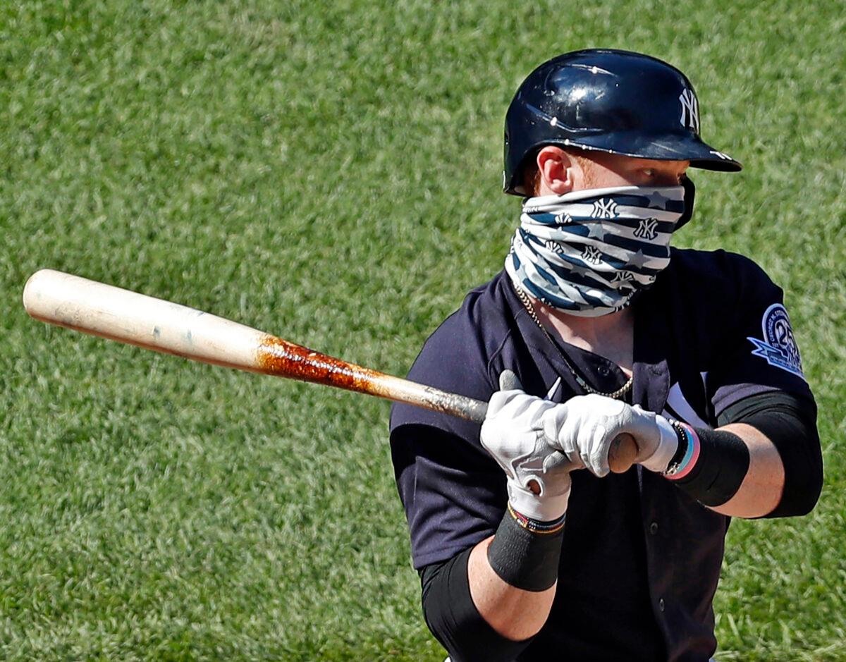 New York Yankees' Clint Frazier wears a face covering while batting during an intrasquad game in baseball summer training camp at Yankee Stadium in New York City on July 12, 2020. (Kathy Willens/AP Photo)