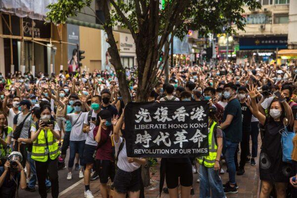 Protesters chant slogans during a rally against the Beijing-imposed new national security law in Hong Kong on July 1, 2020. (Dale De La Rey/AFP via Getty Images)
