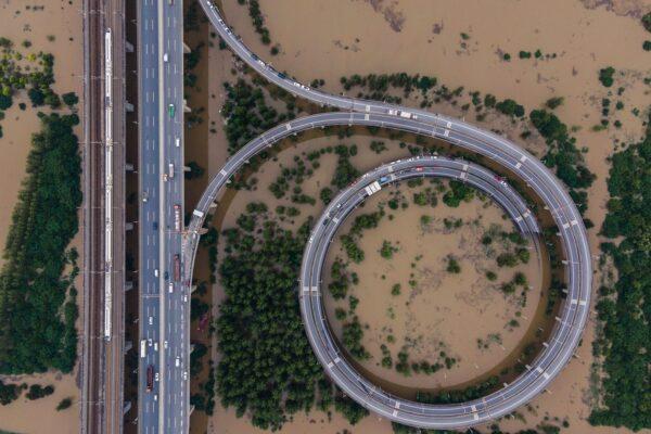 This aerial view shows a bridge leading to the inundated Tianxingzhou island in Wuhan, China on July 13, 2020. (STR/AFP via Getty Images)