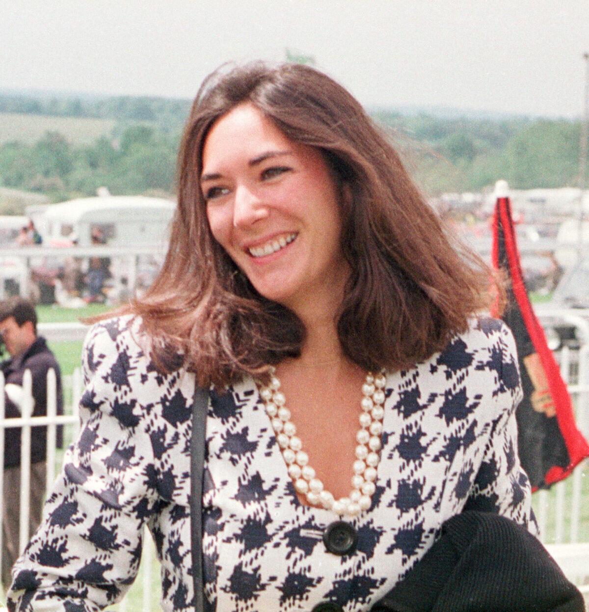 British socialite Ghislaine Maxwell arrives at Epsom Racecourse on June 5, 1991. (Chris Ison/PA via AP)