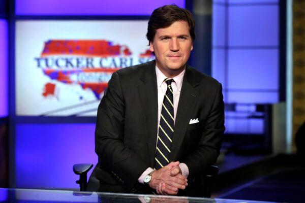 Tucker Carlson poses for photos in a Fox News Channel studio, in New York City, on March 2, 2017. (Richard Drew/AP Photo)
