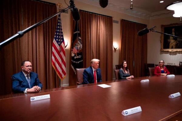 Owner at Goya Foods Robert Unanue (L), Florida Lt. Gov. Jeanette Nunez (2R) and Lourdes Aguirre (R) listen to President Donald Trump speak before signing an Executive Order on the White House Hispanic Prosperity Initiative at the White House in Washington, on July 9, 2020. (Jim Watson/AFP/Getty Images)