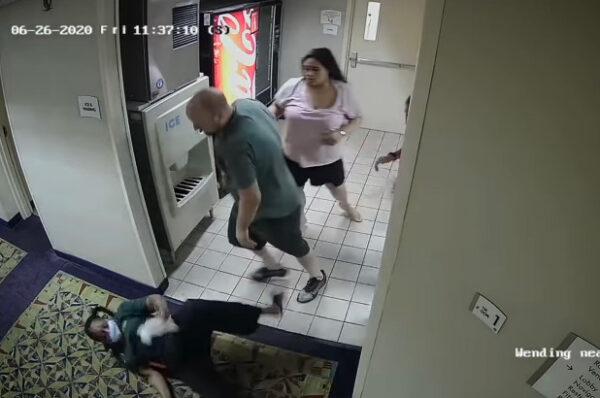 Philip Sarner (C) and Emily Orbay (R) allegedly assaulting a 59-year-old hotel worker in Mystic, Conn., in a file photo. (Stonington Police Department)