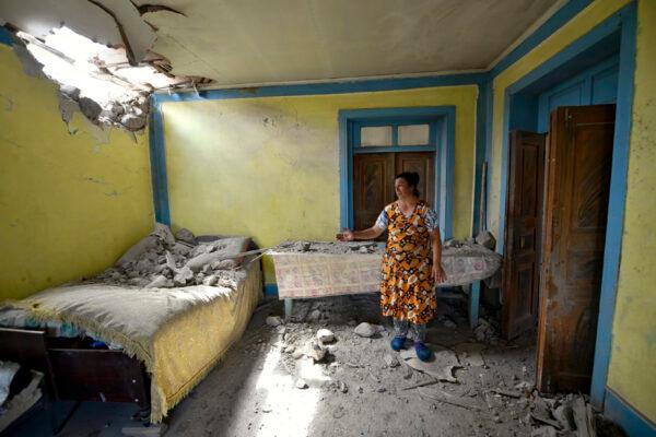 A local woman shows damage in her house after the shelling by Armenian forces in the Tovuz region of Azerbaijan, on July 14, 2020. (Ramil Zeynalov/AP Photo)