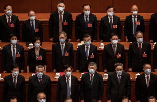 Chinese Communist Party delegates attend the regime’s rubber-stamp legislative conference in Beijing, China, on May 28, 2020. (Kevin Frayer/Getty Images)