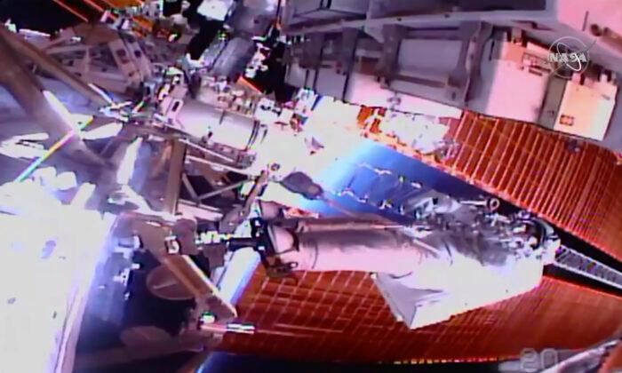 Spacewalking Astronauts Closing in on Final Battery Swaps