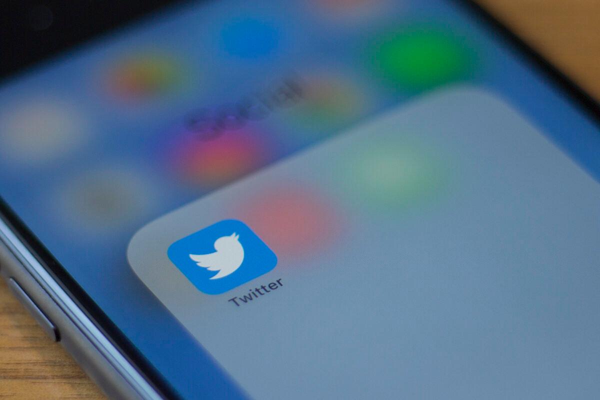 The Twitter logo is seen on a phone in this photo illustration in Washington on July 10, 2019. (Alastair Pike/AFP via Getty Images)