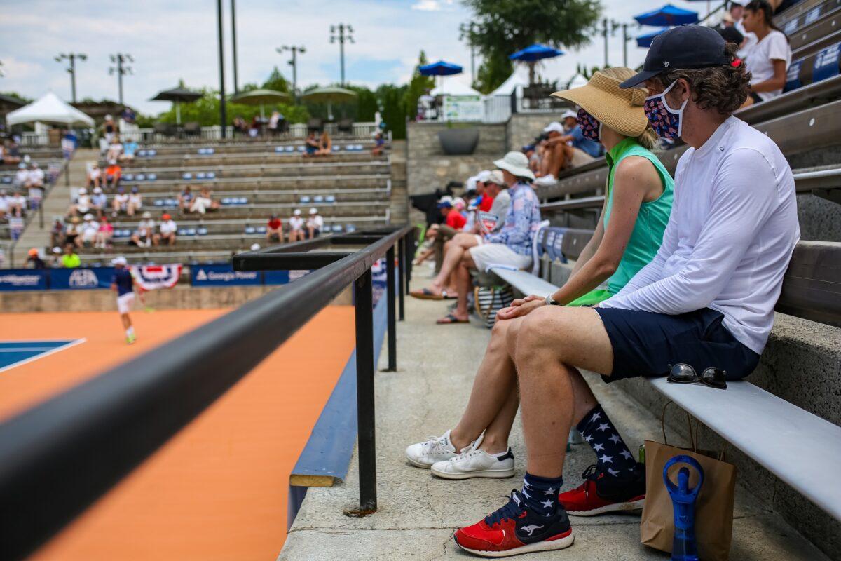 Spectators in masks look on during the DraftKings All-American Team Cup in Atlanta on July 4, 2020. (Carmen Mandato/Getty Images)