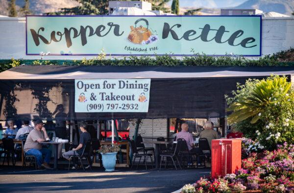 A new sign adorns the storefront of the Kopper Kettle in Yucaipa, Calif., on July 10, 2020. (John Fredricks/The Epoch Times)