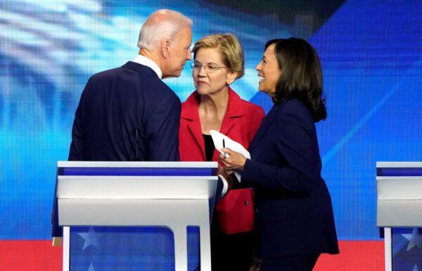 Former Vice President Joe Biden talks with Sens. Elizabeth Warren (C) and Kamala Harris (R) after the conclusion of the 2020 Democratic U.S. presidential debate in Houston, on Sept. 12, 2019. (Mike Blake/File Photo/Reuters)