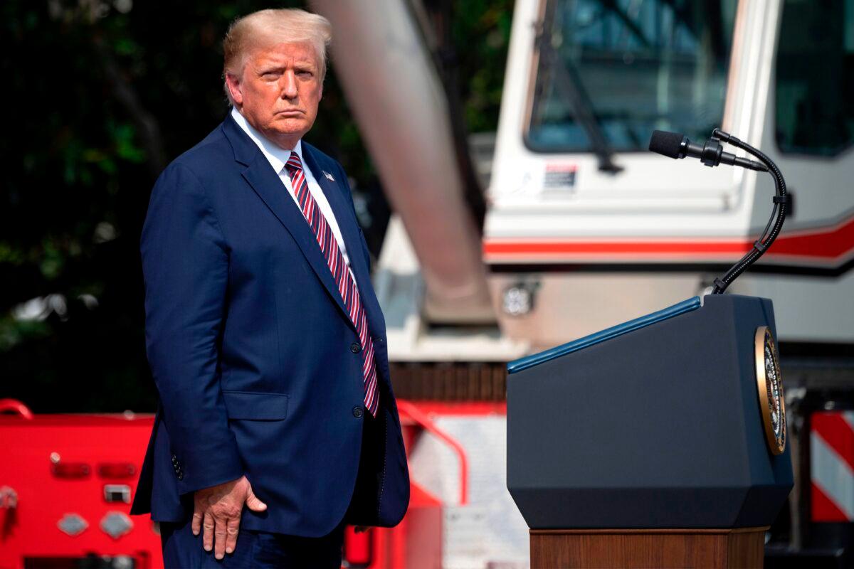President Donald Trump looks on before delivering remarks on Rolling Back Regulations to Help All Americans on the South Lawn at the White House on July 16, 2020. (Jim Watson/AFP via Getty Images)