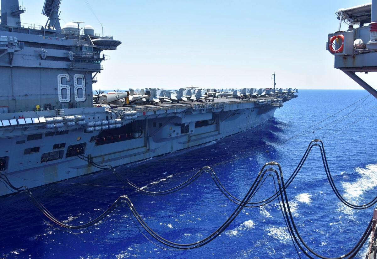 The U.S. Navy aircraft carrier USS Nimitz receives fuel from the Henry J. Kaiser-class fleet replenishment oiler USNS Tippecanoe during an underway replenishment in the South China Sea on July 7, 2020. (U.S. Navy/Christopher Bosch/Handout via Reuters)