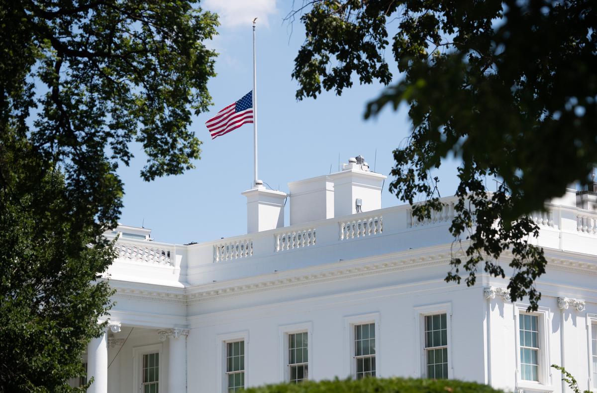 The American flag flies at half staff over the White House in the District of Columbia on July 18, 2020, in honor of Rep. John Lewis (D-Ga.) who died on Friday at age 80. (Saul Loeb/AFP via Getty Images)