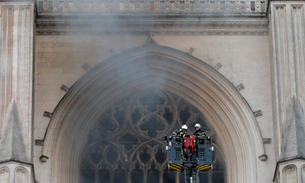 French firefighters battle a blaze at the Cathedral of Saint Pierre and Saint Paul in Nantes, France, on July 18, 2020. (Stephane Mahe/Reuters)