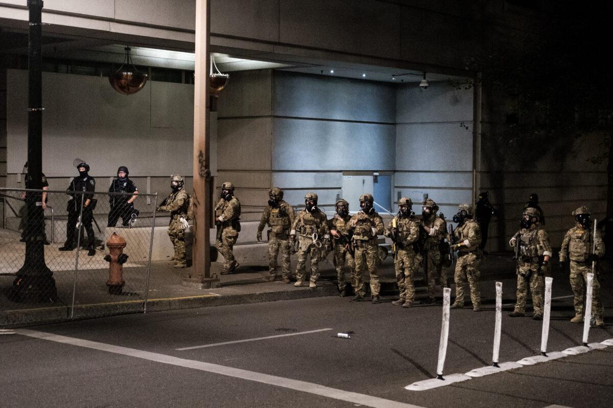 Federal officers prepare to disperse the crowd of protestors outside the Multnomah County Justice Center in Portland, Ore., on July 17, 2020. (Mason Trinca/Getty Images)