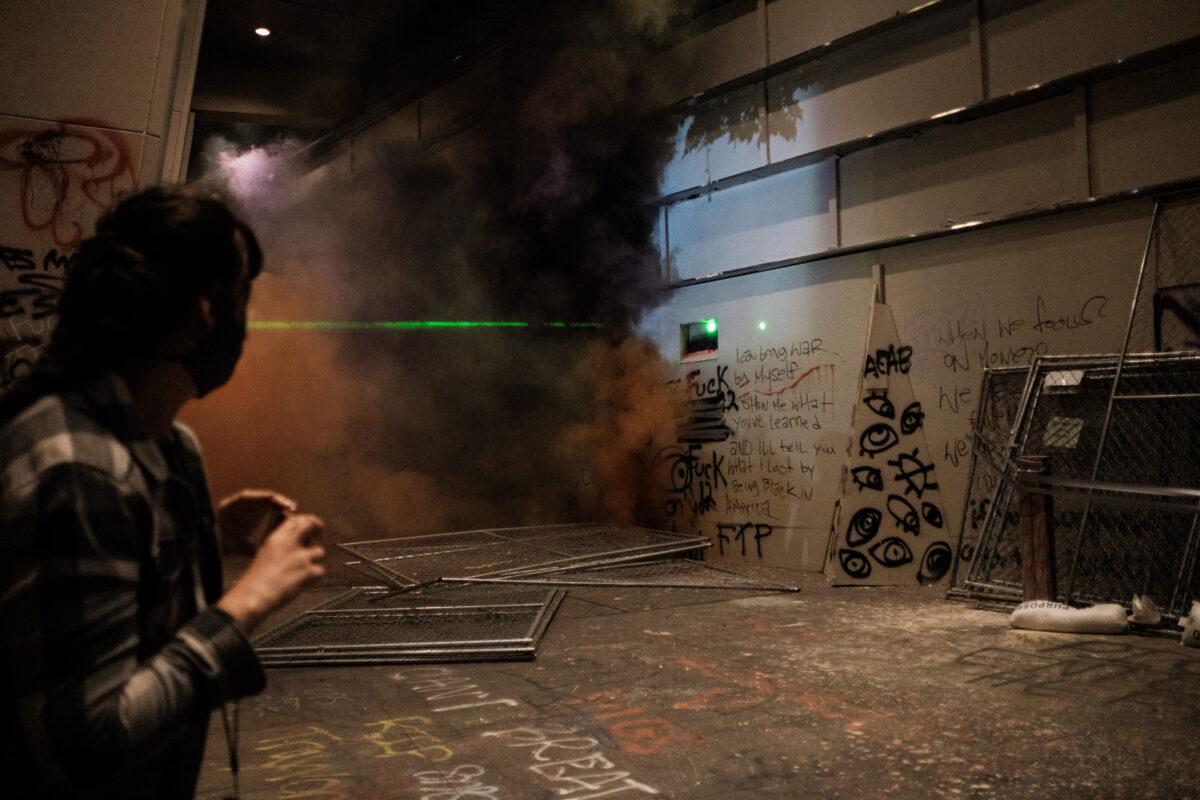  Rioters set off smoke grenades on the steps of Mark O. Hatfield Courthouse in Portland, Ore., on July 17, 2020. (Mason Trinca/Getty Images)