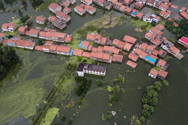 An aerial view shows flooded residential buildings in Jiujiang, China's central Jiangxi Province, on July 18, 2020. (HECTOR RETAMAL/AFP via Getty Images)